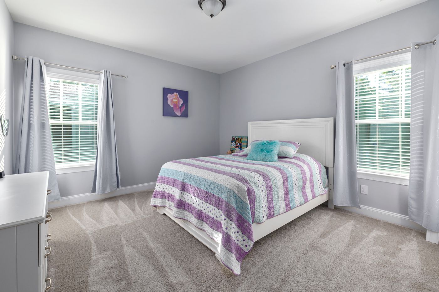 Carpet inspiration: finished carpeted bedroom in a different property, illustrative stock photo